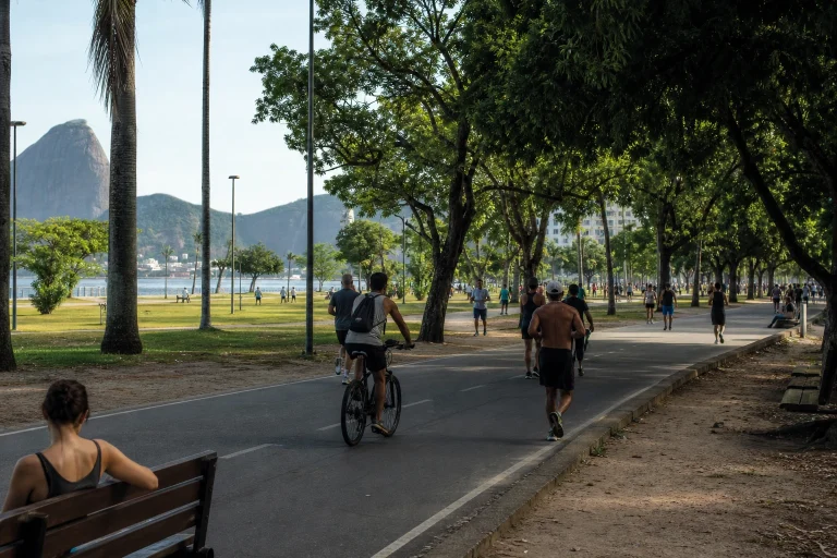 Walkers and cyclists using the green leisure area at Flamengo Park in Rio de Janeiro
