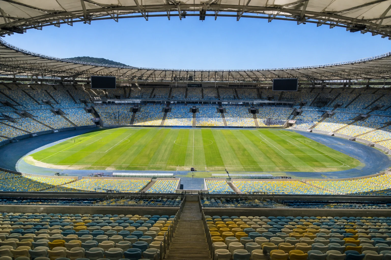 Interior of a large football stadium during a daytime tour