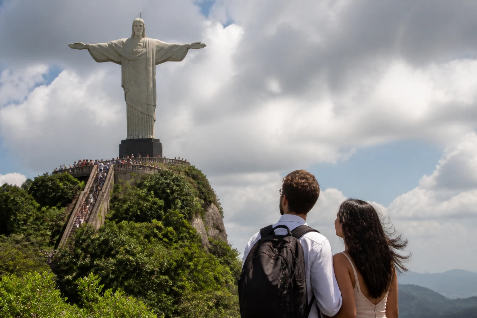 Couple visiting Christ the Redeemer in Rio de Janeiro