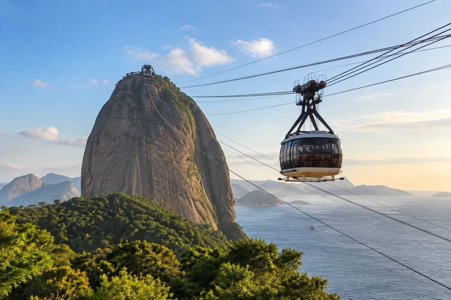 Cable car traveling toward Sugarloaf Mountain in Rio de Janeiro